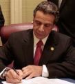 Andrew-Cuomo-signs-bill.JPG